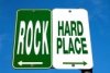 7529282-road-sign--between-a-rock-and-a-hard-place.jpg