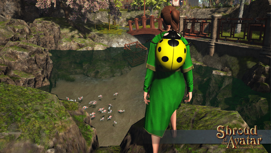 A child wearing a green dress and a yellow ladybug backpack